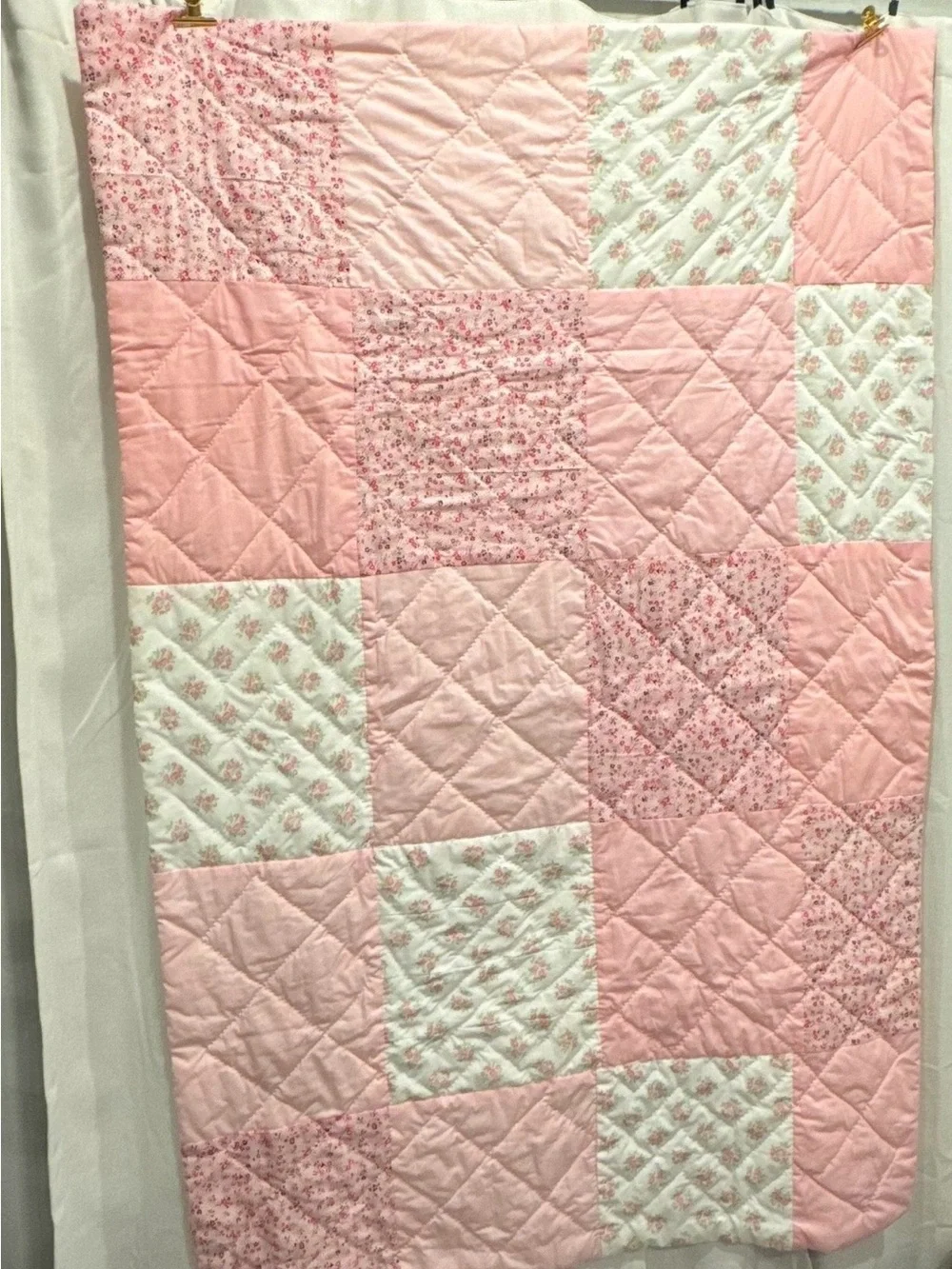 Handmade Pink Patchwork Quilt for your babies crib or toddler bed.